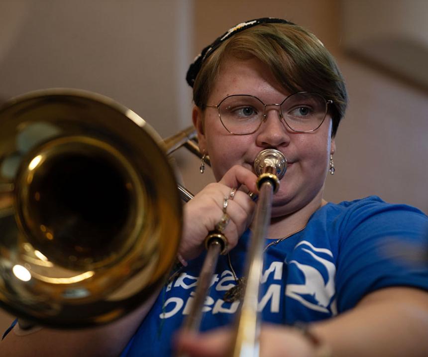 A student plays trombone